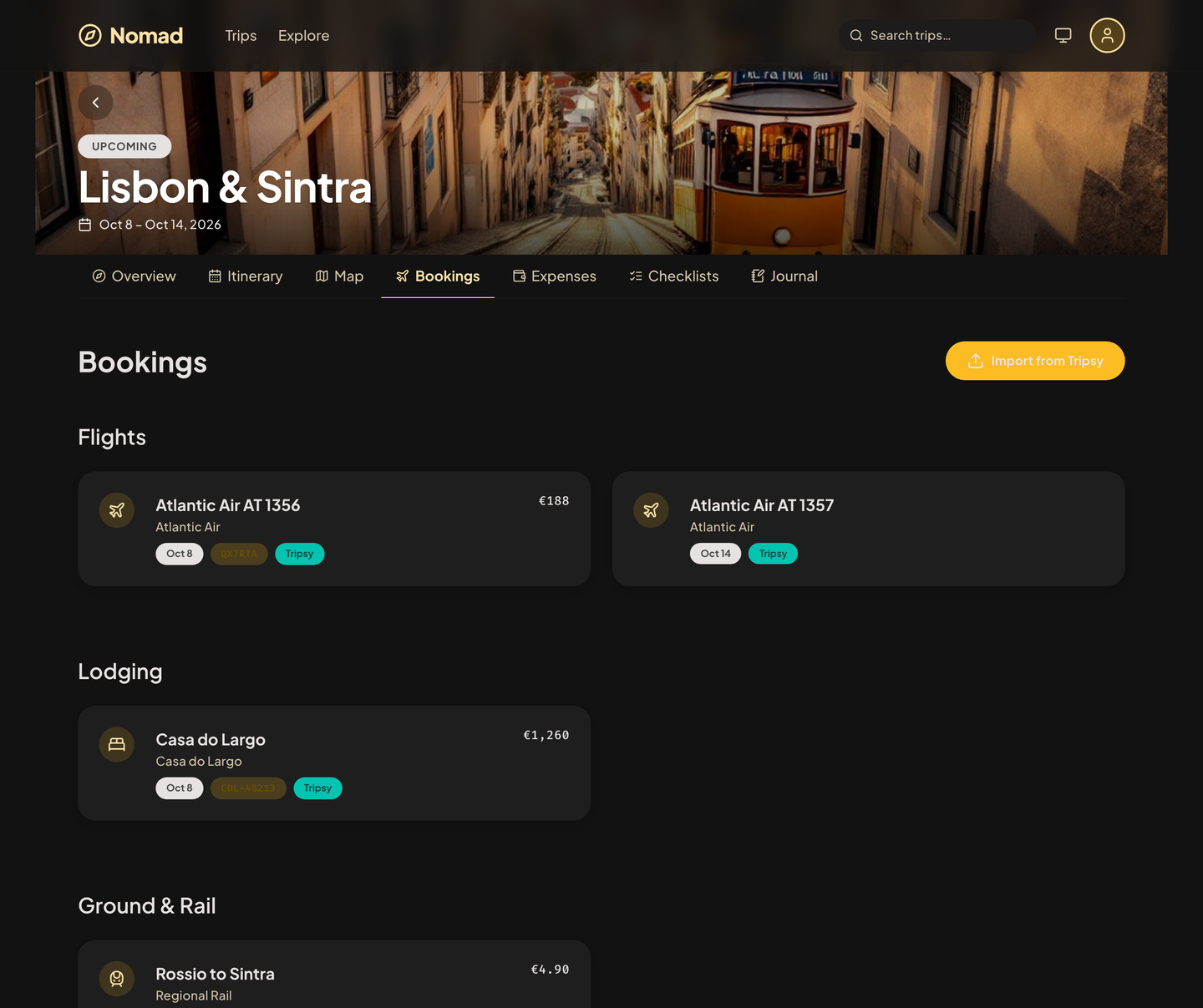 Nomad bookings for a Lisbon trip, grouped into flights, lodging, and ground and rail, each with its confirmation code.