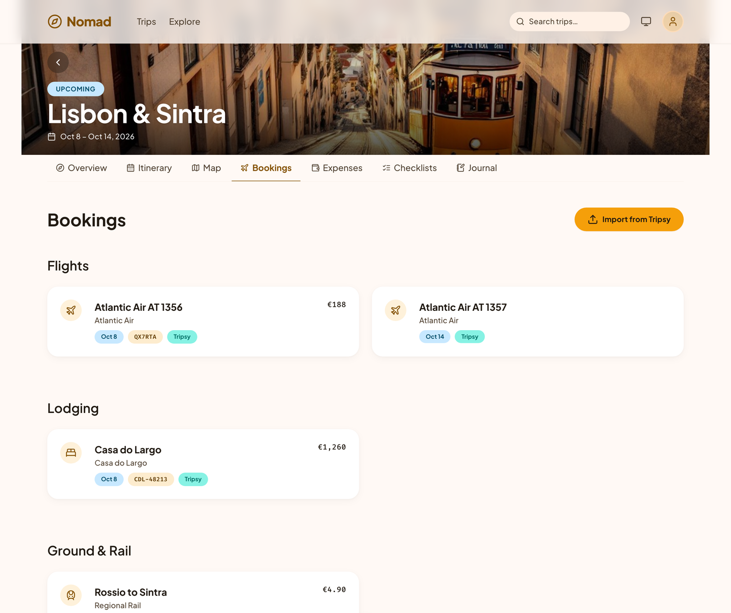 Nomad bookings for a Lisbon trip, grouped into flights, lodging, and ground and rail, each with its confirmation code.