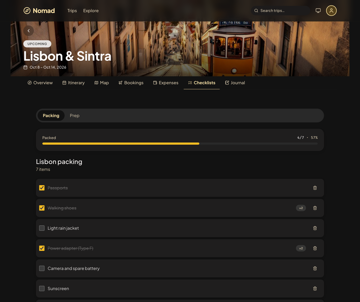 A Nomad packing list for Lisbon, four of seven items packed, with a progress bar.