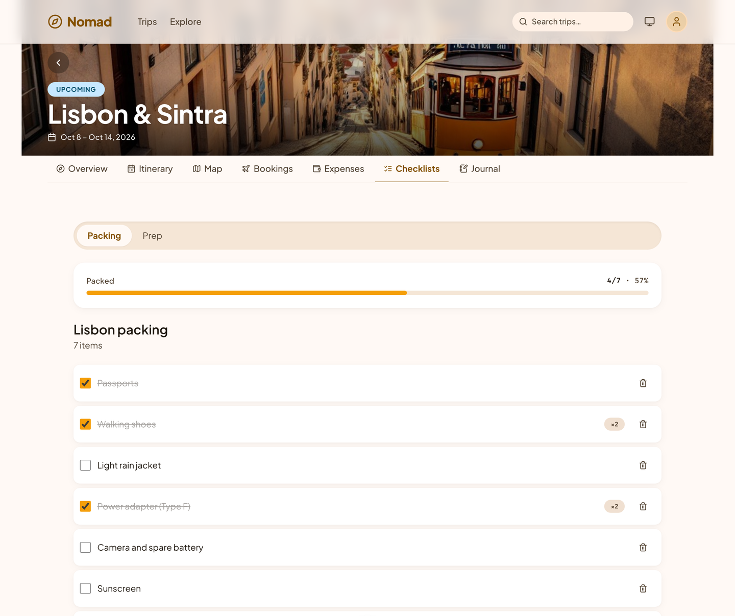 A Nomad packing list for Lisbon, four of seven items packed, with a progress bar.